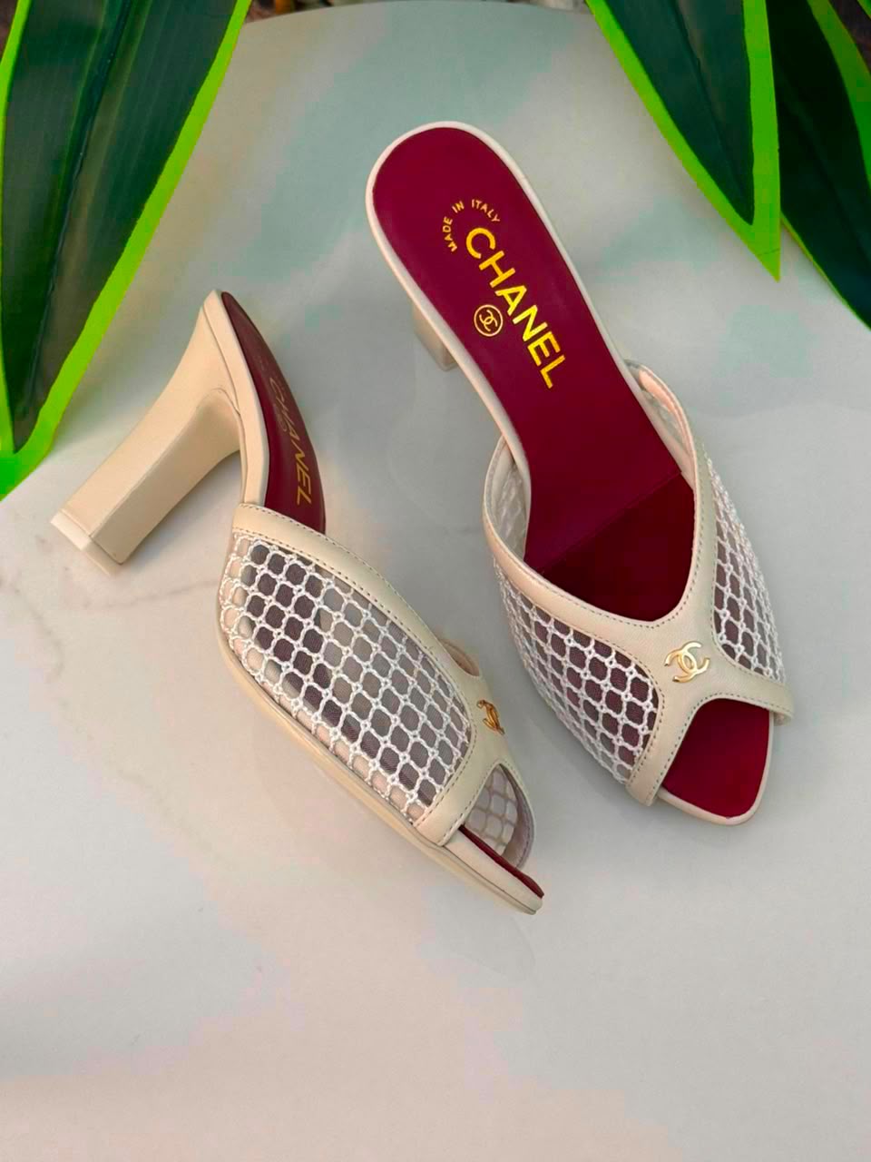 Chanel Mules Featuring a Striking White Mesh Upper
