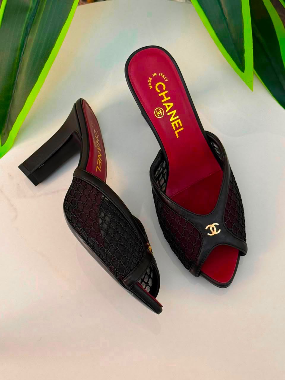 Chanel Mules Featuring a Striking White Mesh Upper