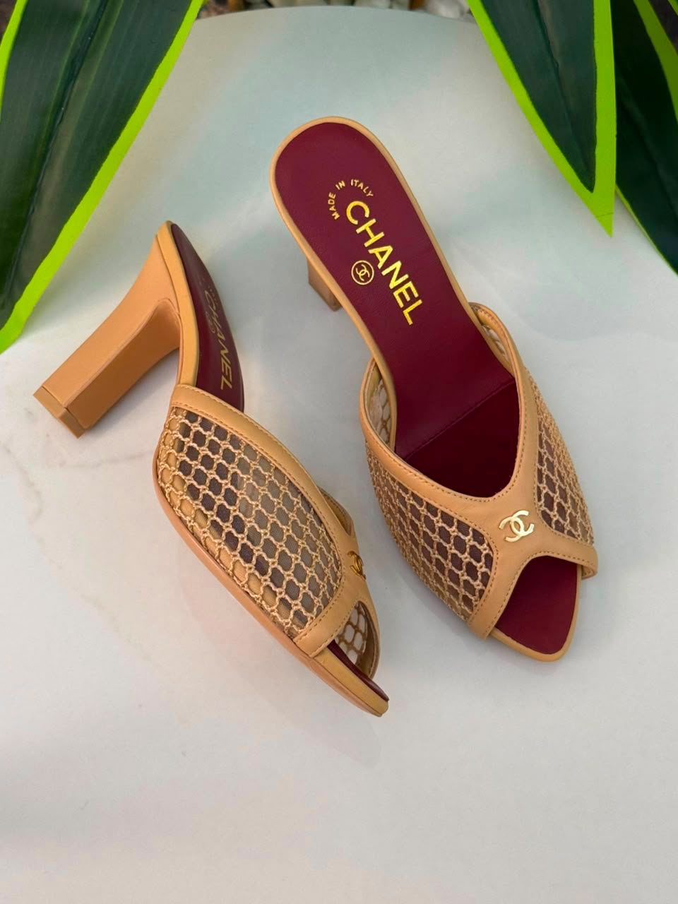 Chanel Mules Featuring a Striking White Mesh Upper