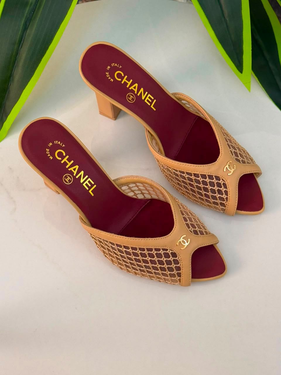 Chanel Mules Featuring a Striking White Mesh Upper