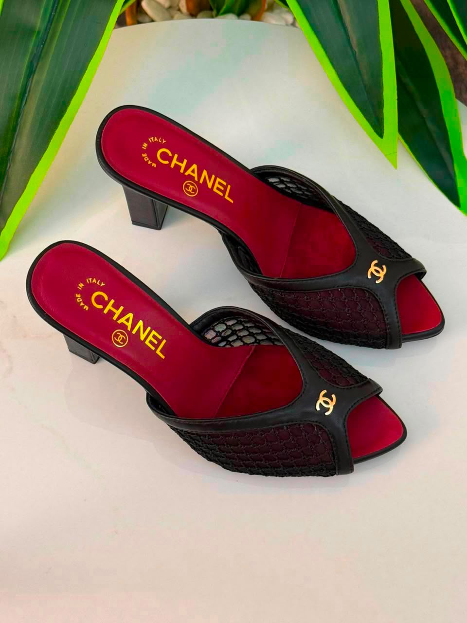Chanel Mules Featuring a Striking White Mesh Upper