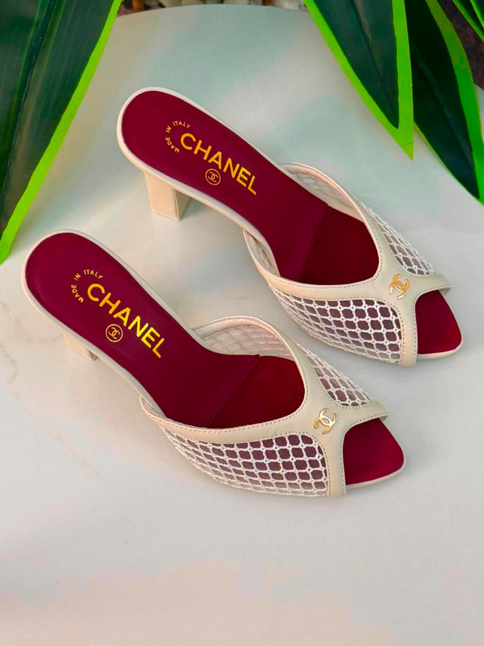 Chanel Mules Featuring a Striking White Mesh Upper