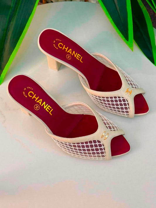 Chanel Mules Featuring a Striking White Mesh Upper