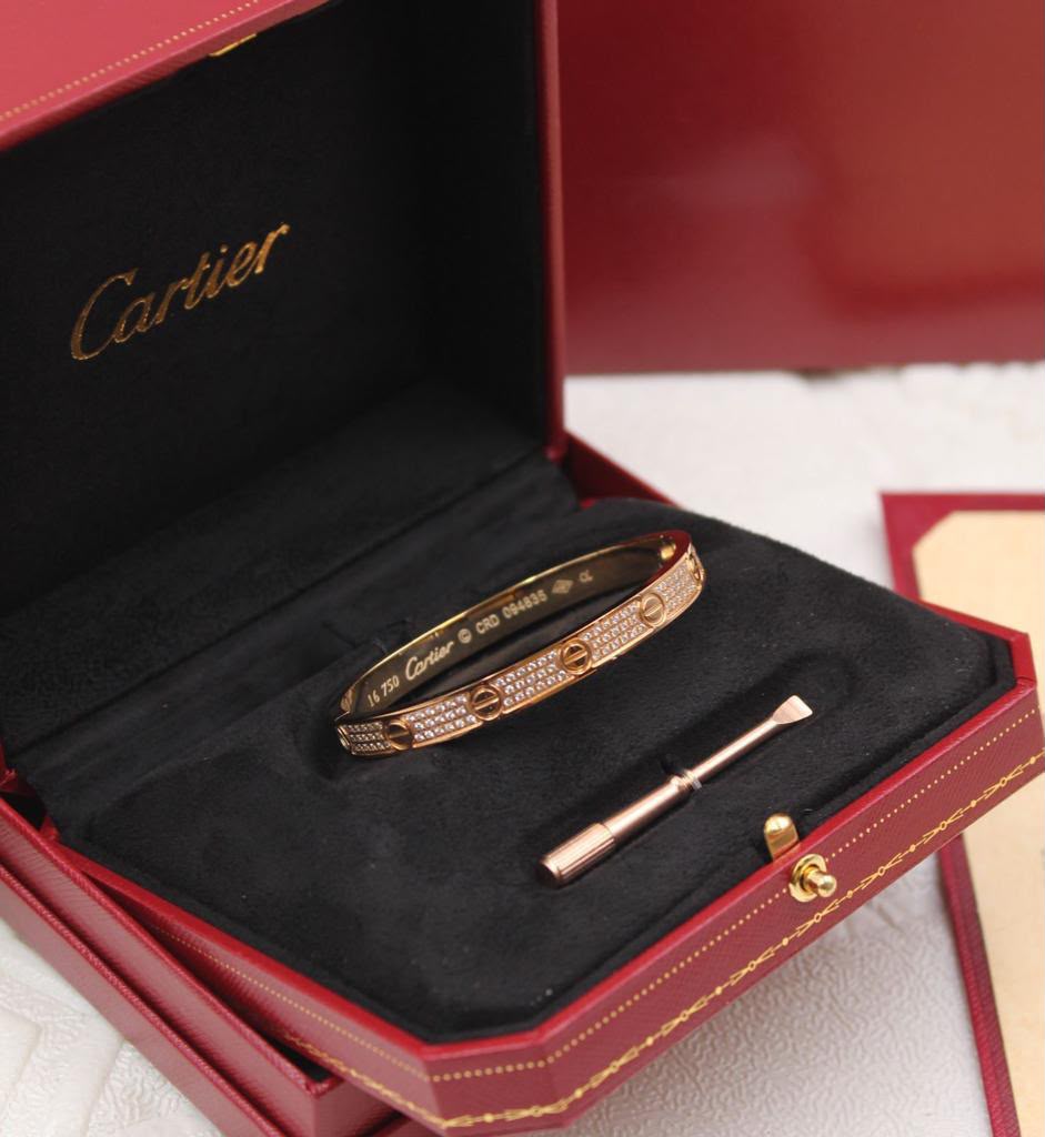 FAYZA screw-motif pavé bangle with screwdriver in a red presentation case