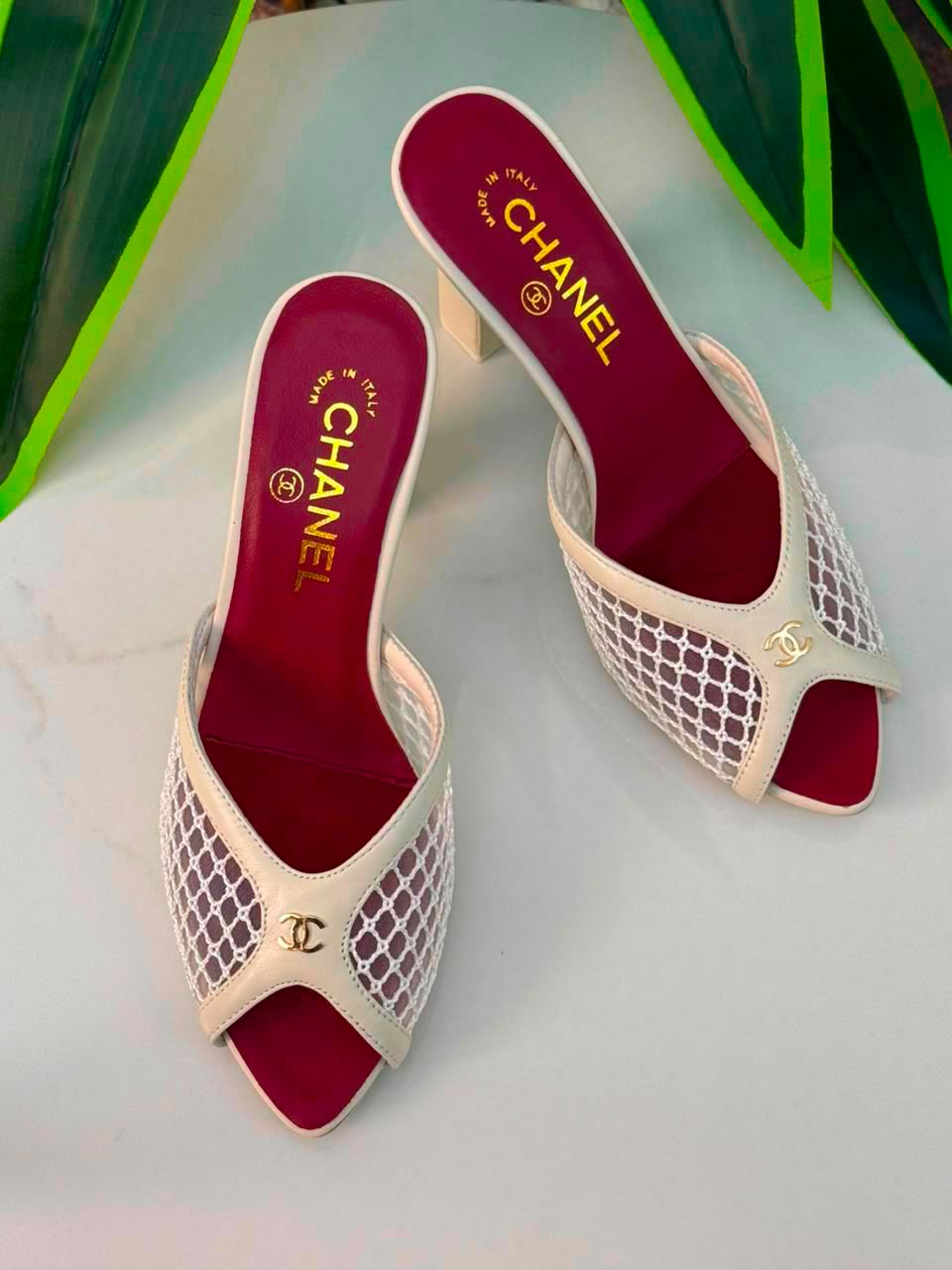 Chanel Mules Featuring a Striking White Mesh Upper
