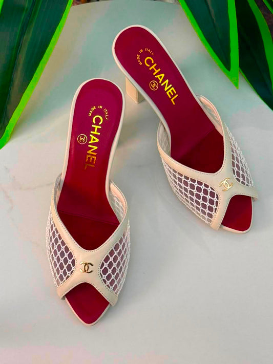 Chanel Mules Featuring a Striking White Mesh Upper