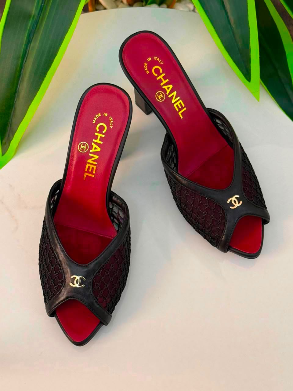 Chanel Mules Featuring a Striking White Mesh Upper